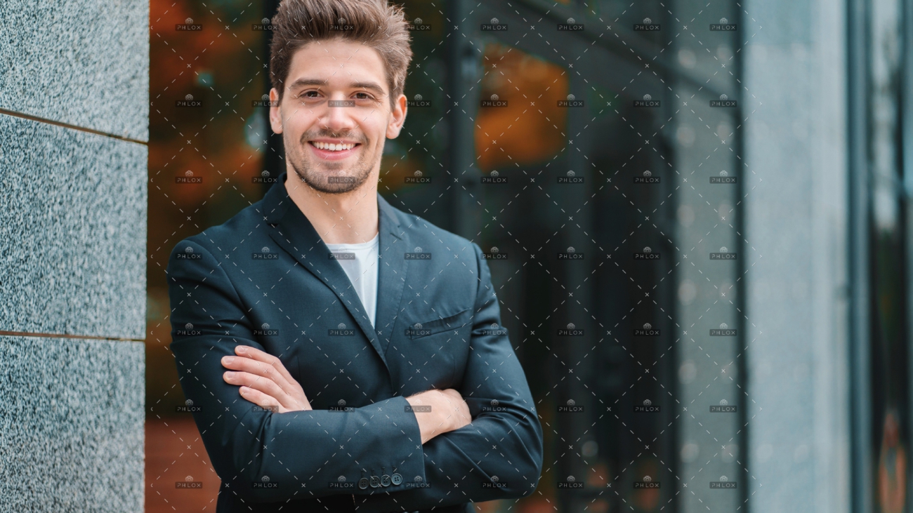 demo-attachment-356-portrait-of-young-successful-confident-businessman-in-the-city-on-office-building-background-man-in_t20_AlnLA0